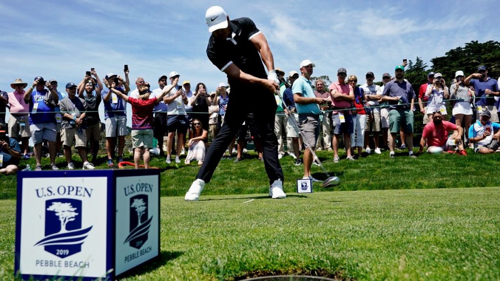 Brooks Koepka hits his tee shot on the ninth hole during a practice round for the US Open (David J Phillip/AP)