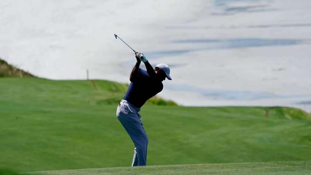 Tiger Woods hits on the ninth hole during a practice round for the US Open at Pebble Beach (David J. Phillip/AP)