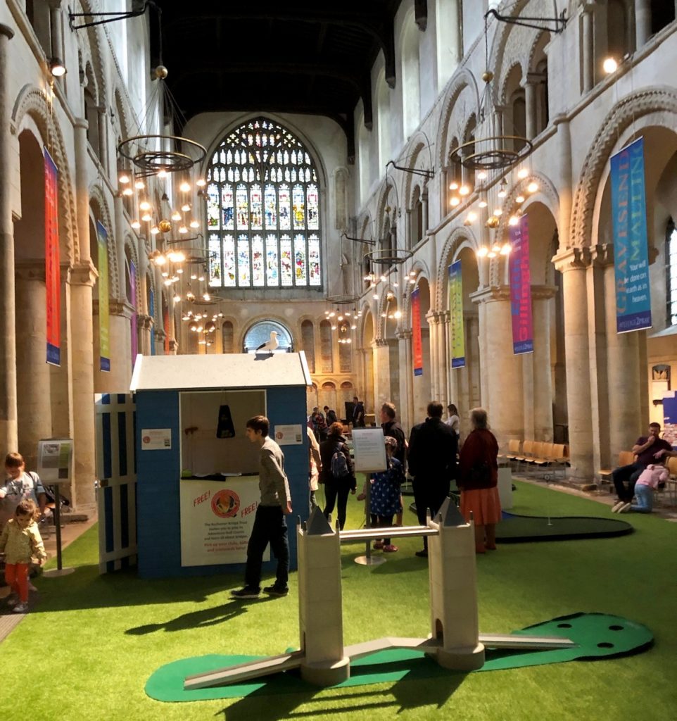 Crazy Cathedral - Rochester. Amid some controversy, a 9-hole crazy golf course has been laid out in the central aisle of the medieval cathedral