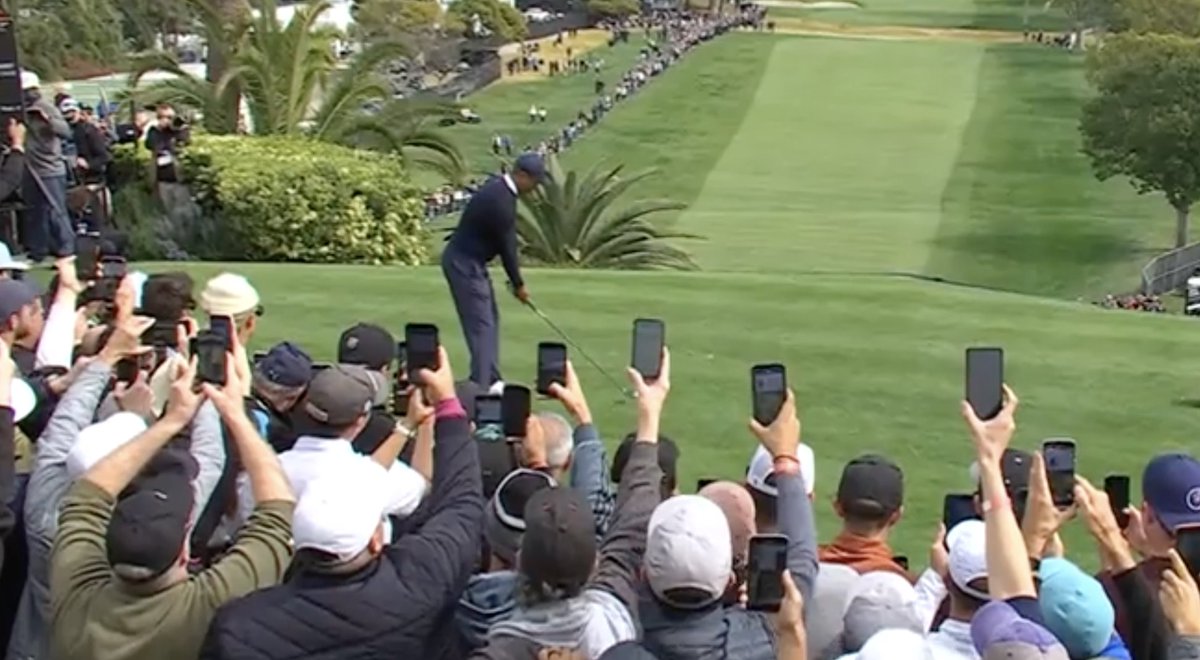 Tiger Woods tees off