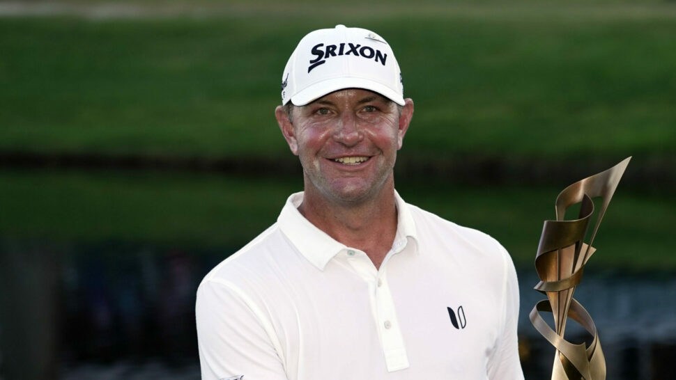 Lucas Glover holds the trophy after winning the St Jude Championship golf tournament