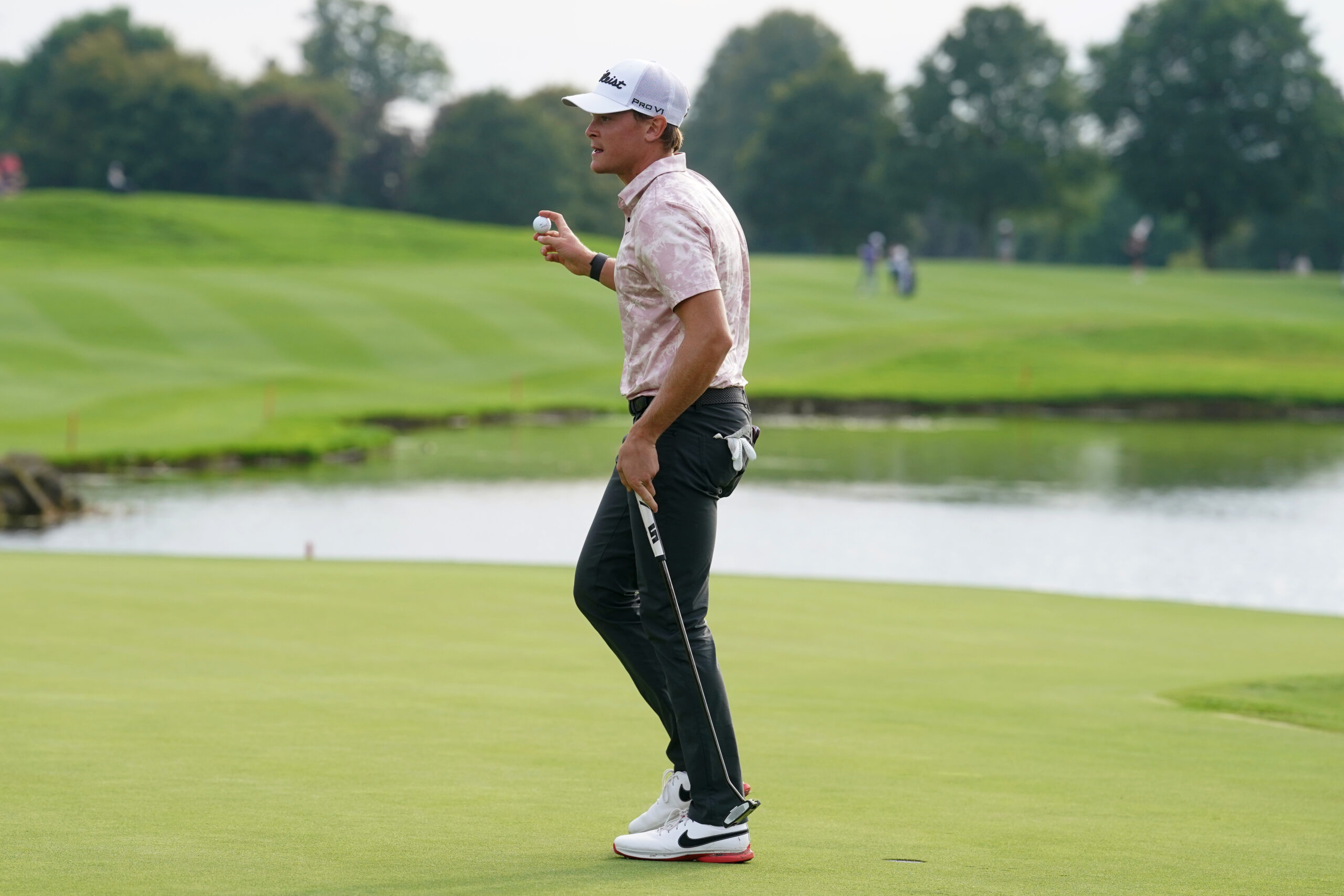 Vincent Norrman reacts after holing the winning putt on the 18th hole