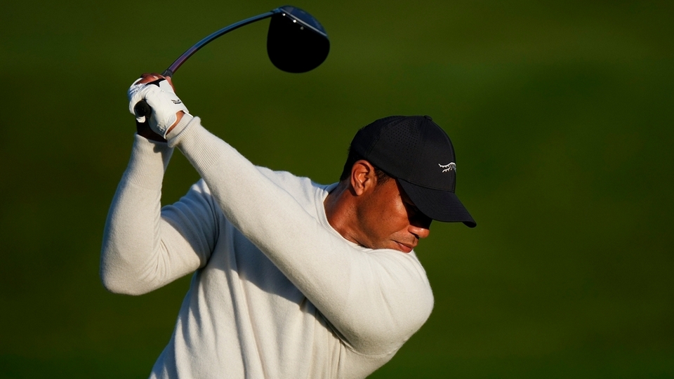 Tiger Woods hits on the driving range during a practice round