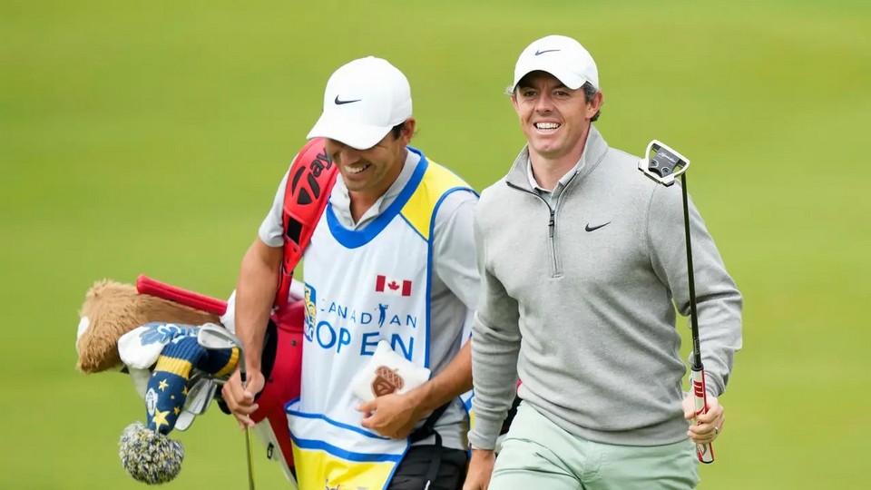 Rory McIlroy, right, laughs with his caddie Harry Diamond on the eighth hole during the second round of the RBC Canadian Open