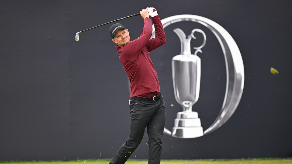 Justin Rose of England tees off on the first hole on day four