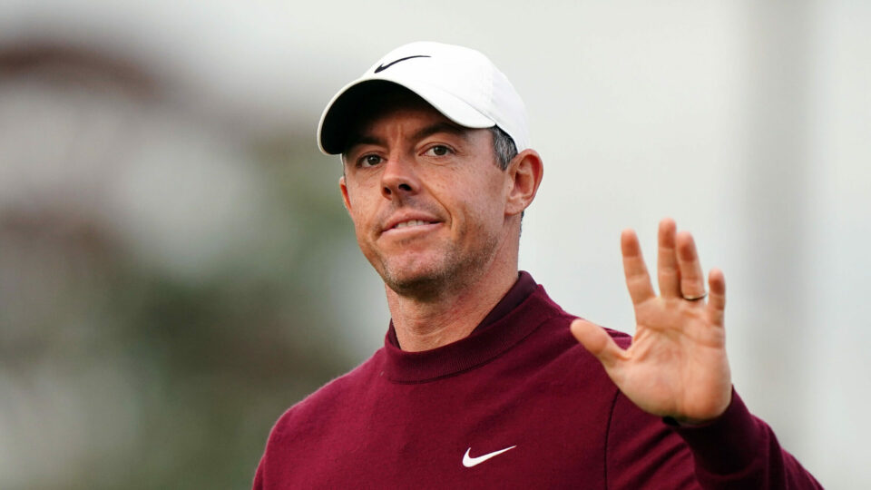 A disappointed Rory McIlroy waves to the crowd