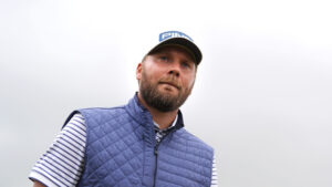 Close-up of golfer Daniel Brown wearing a blue gilet