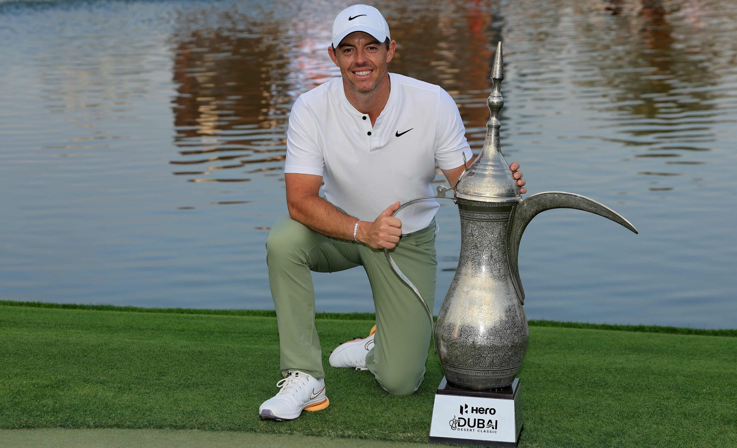 Rory McIlroy poses with the Dallah Trophy after a record fourth victory in 2024