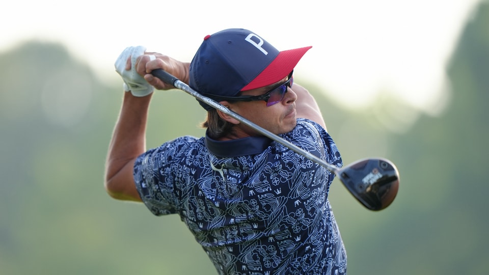 Rickie Fowler hits his tee shot on the 10th hole during the first round of the PGA Championship at Quail Hollow Club