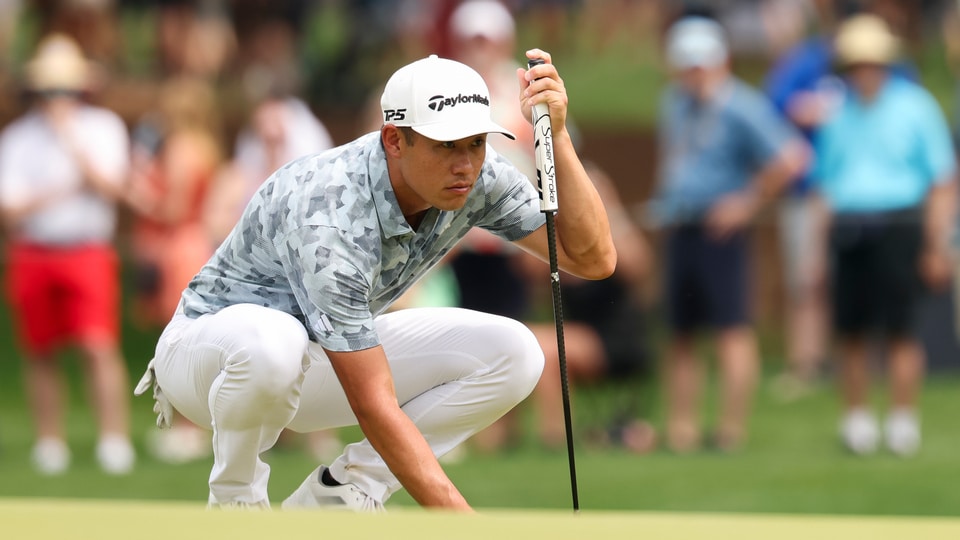 Collin Morikawa reads his putt on the fifth hole during the second round