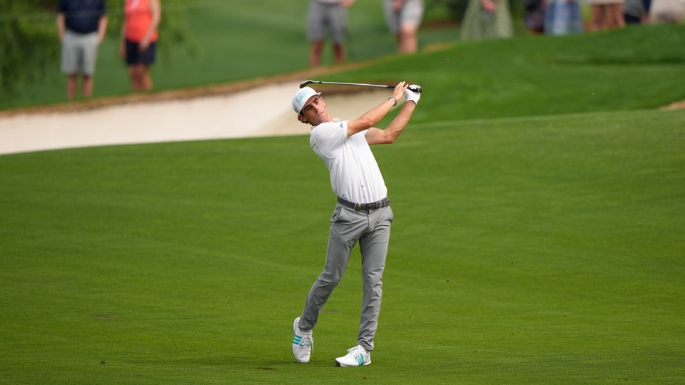 Joaquin Niemann hits his second shot on the fifth hole during the second round