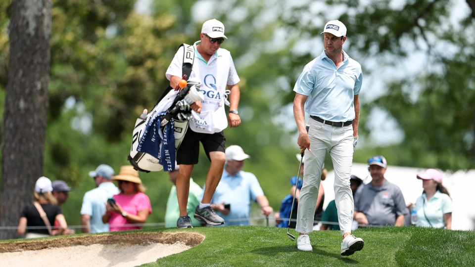 Harris English with his caddie on the 10th hole fairway during the third round of the PGA Championship at Quail Hollow