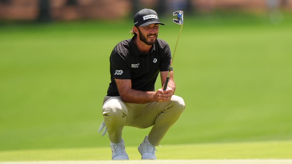 Max Homa reads his putt on the second hole during the third round