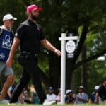 on Rahm walks off the second hole tee box during the final round of the PGA Championship at Quail Hollow Club