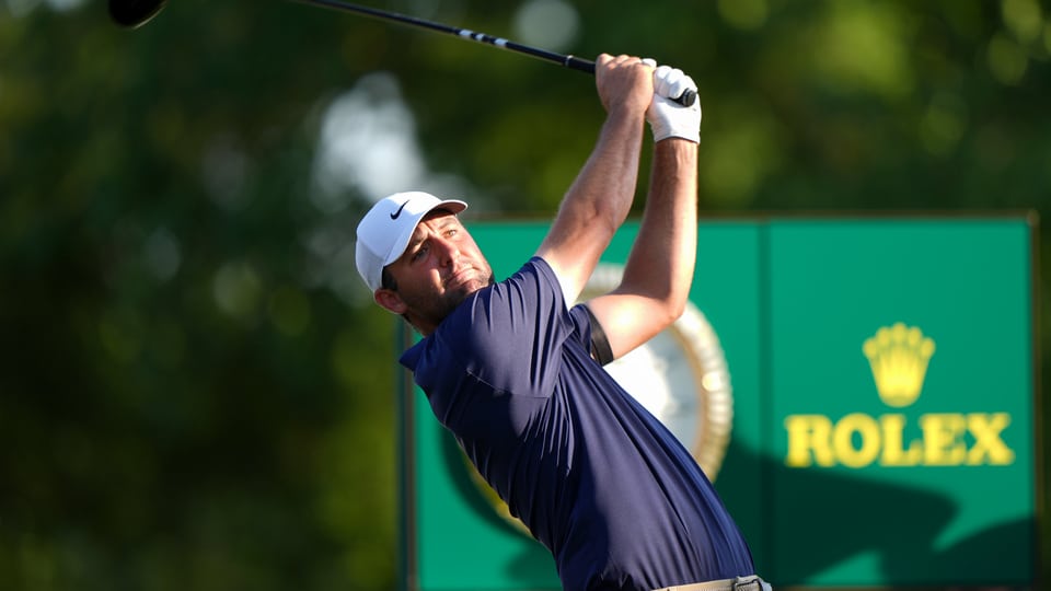 Scottie Scheffler hits his tee shot on the 18th hole during the final round of the PGA Championship at Quail Hollow Club