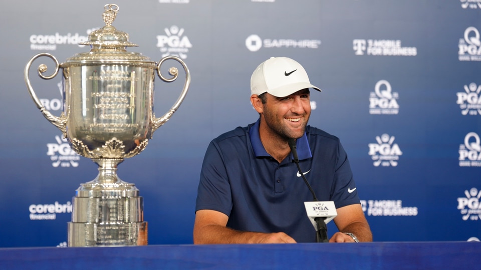 Scottie Scheffler sits down for an interview alongside the Wanamaker trophy after winning the PGA Championship at Quail Hollow Club on Sunday