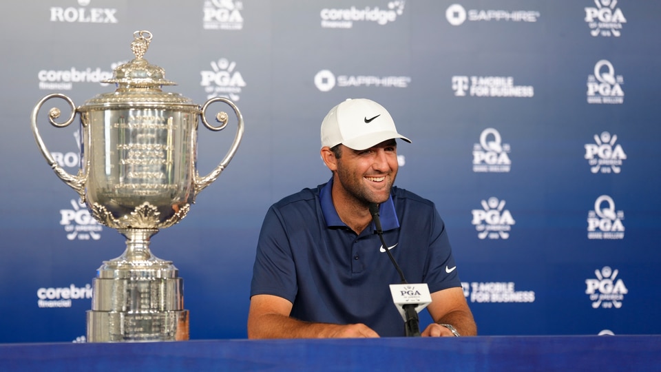 Scottie Scheffler sits down for an interview alongside the Wanamaker trophy after winning