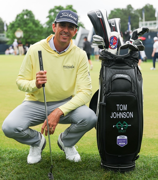 Tom Johnson poses on the practice putting green 