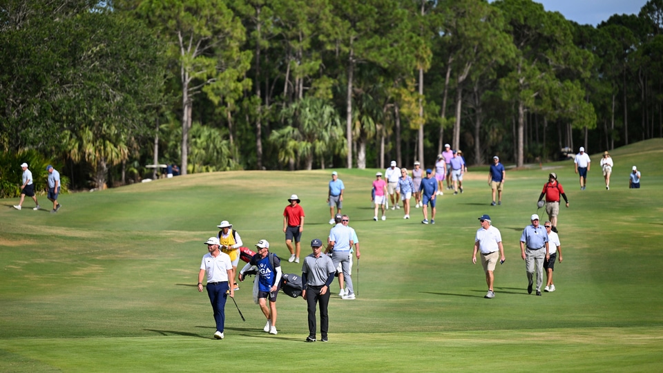  Tyler Collet and Jesse Droemer walk up the 16th hole fairway during the final round