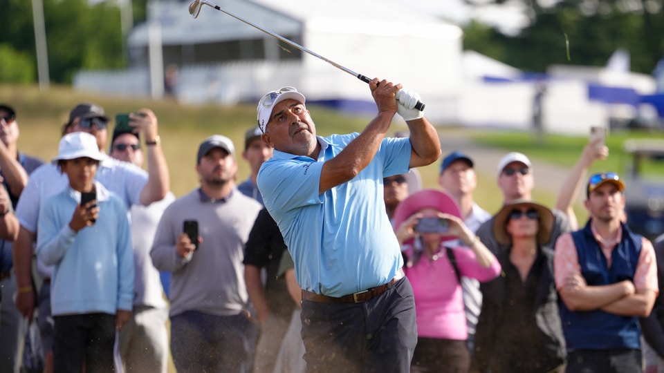 Angel Cabrera hits his second shot on the 18th hole during the final round of the Senior PGA Championship at Congressional Country Club 