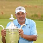 Angel Cabrera poses with the Alfred S. Bourne Trophy after winning the Senior PGA Championship at Congressional Country Club