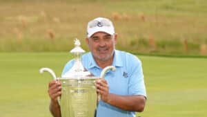 Angel Cabrera poses with the Alfred S. Bourne Trophy after winning the Senior PGA Championship at Congressional Country Club