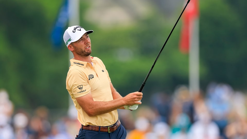 Sam Burns watches his tee shot on the fifth hole during the second round 