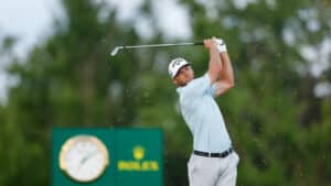 Sam Burns plays his tee shot on the 16th hole during the third round