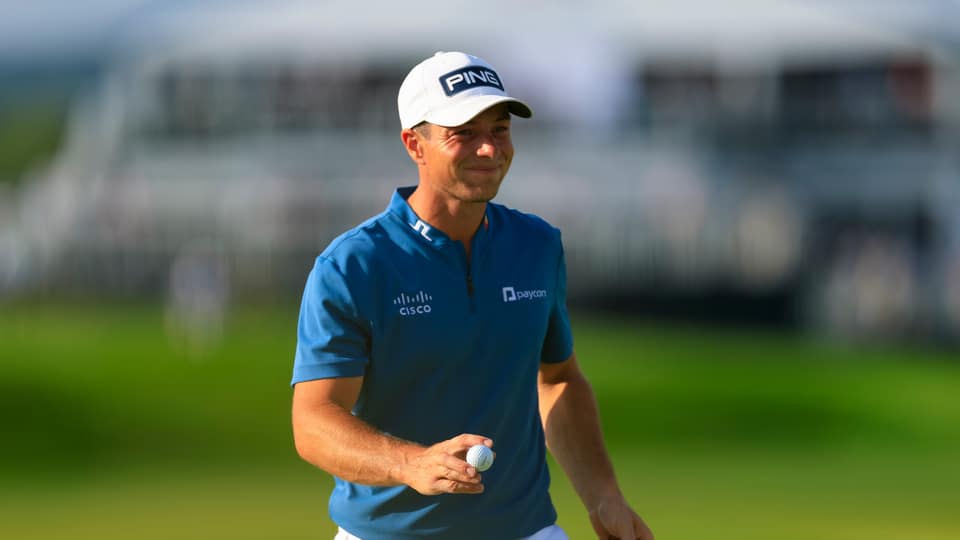 Viktor Hovland walks off the 14th green during the third round