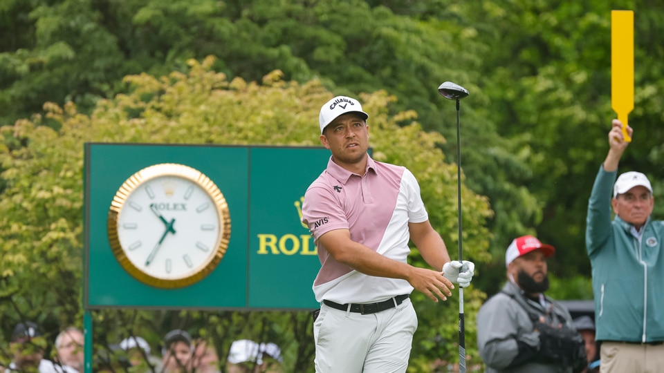 Xander Schauffele plays a shot on the first hole during the third round