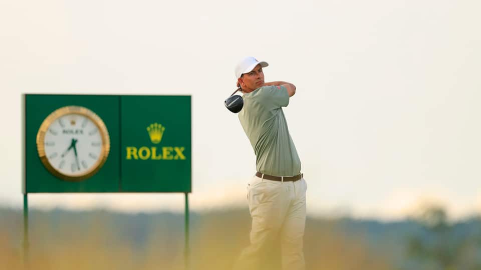 Adam Scott plays his tee shot on the 18th hole during the third round