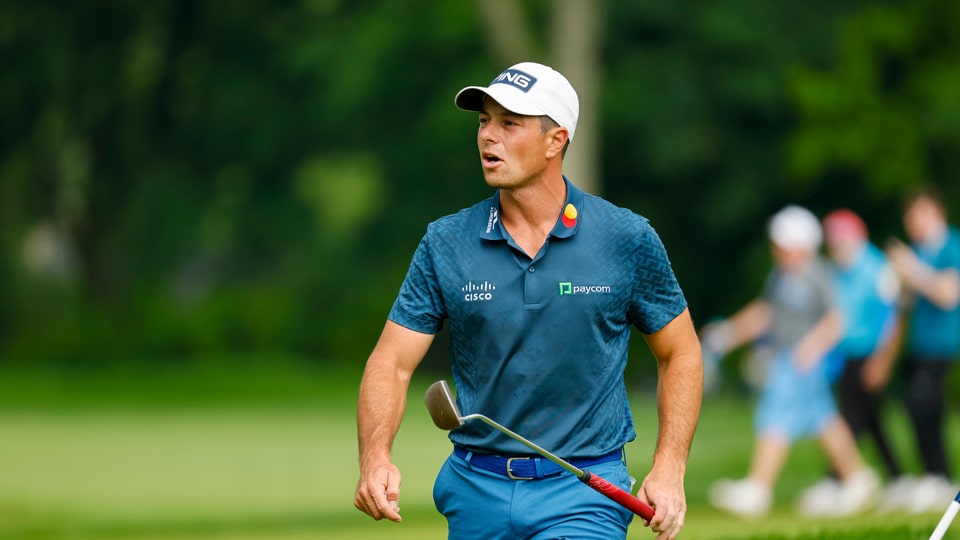 Viktor Hovland walks off the ninth hole during the final round 