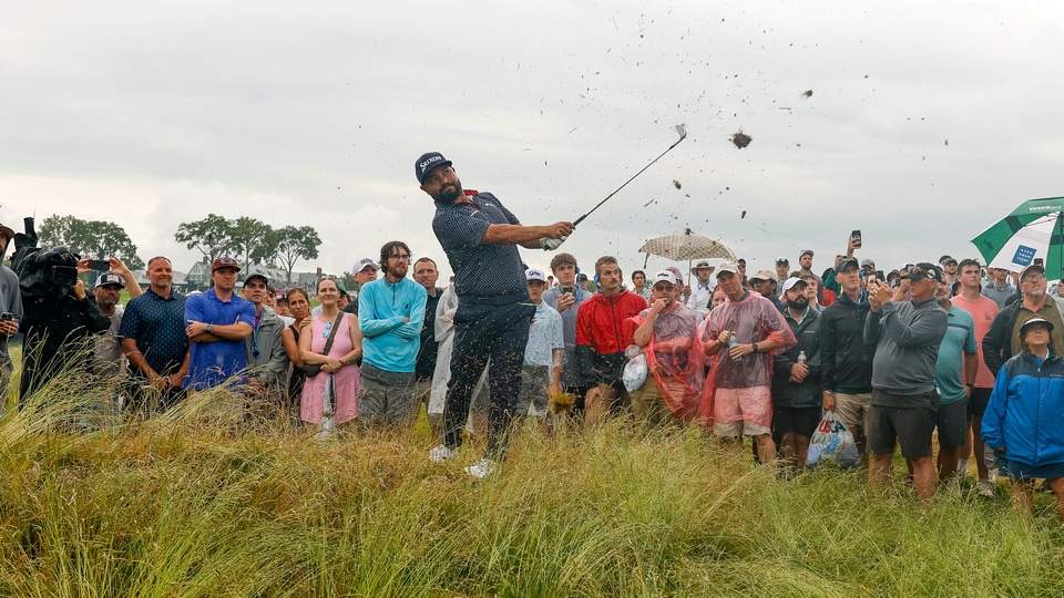 J.J. Spaun plays his shot on the 12th hole while the crowd looks on during the final round of the 2025 U.S. Open at Oakmont Country Club