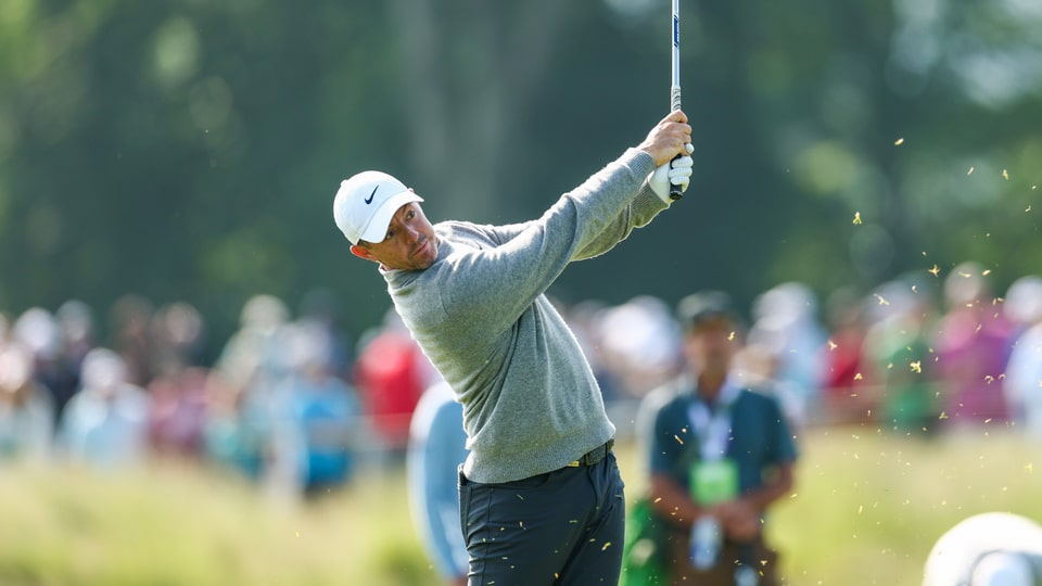 Rory McIlroy plays a shot on the ninth hole during a practice round ahead of the 2025 U.S. Open at Oakmont Country Club in Oakmont, Pa