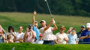 Scottie Scheffler plays a shot on the fourth hole during a practice round ahead of the 2025 U.S. Open
