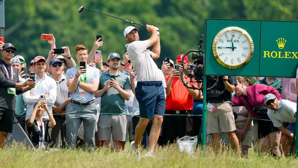 Scottie plays a shot on the eighth hole during a practice round